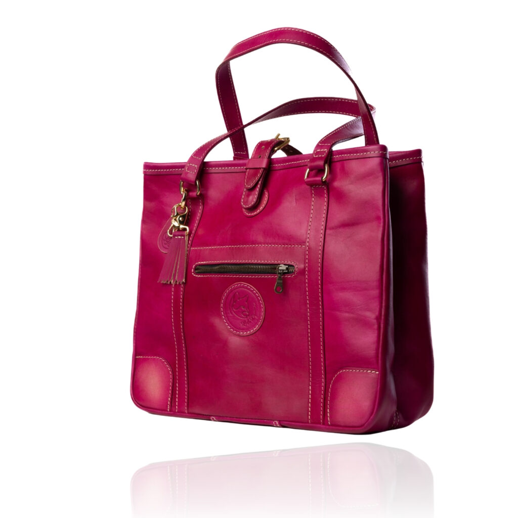 The Jean Tote handcrafted in hand-dyed Cerise Rouge genuine leather with Regency Velvet lining and premium Morini Italian hardware