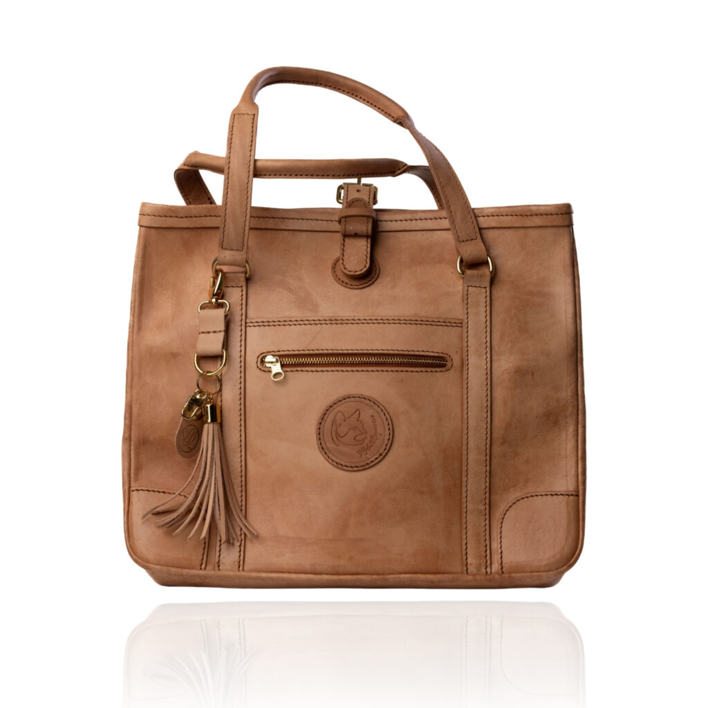The Jean Tote handcrafted in a natural finish genuine leather with Regency Velvet lining and premium Morini Italian hardware