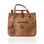 The Jean Tote handcrafted in a natural finish genuine leather with Regency Velvet lining and premium Morini Italian hardware