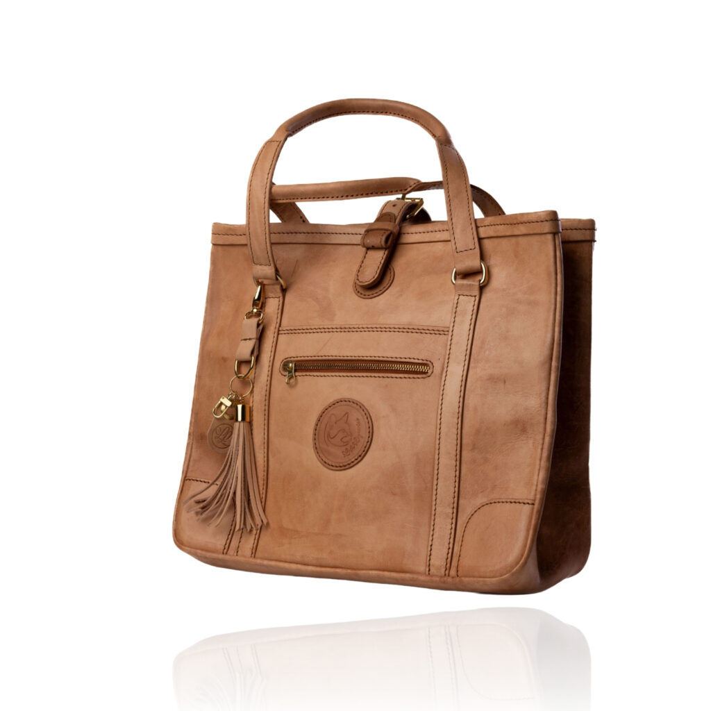 The Jean Tote handcrafted in a natural finish genuine leather with Regency Velvet lining and premium Morini Italian hardware