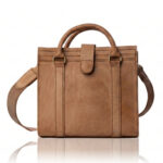The Marilyn Mini Tote handcrafted in natural finish genuine leather with twin handles, shoulder strap, Regency Velvet lining and Italian hardware.