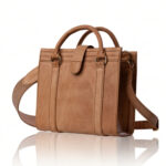 The Marilyn Mini Tote handcrafted in natural finish genuine leather with twin handles, shoulder strap, Regency Velvet lining and Italian hardware.